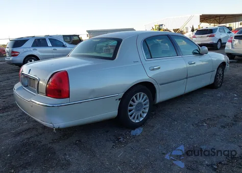 2004 Lincoln Town Car Ultimate из США, поврежденный, VIN 1LNHM83W24Y634984